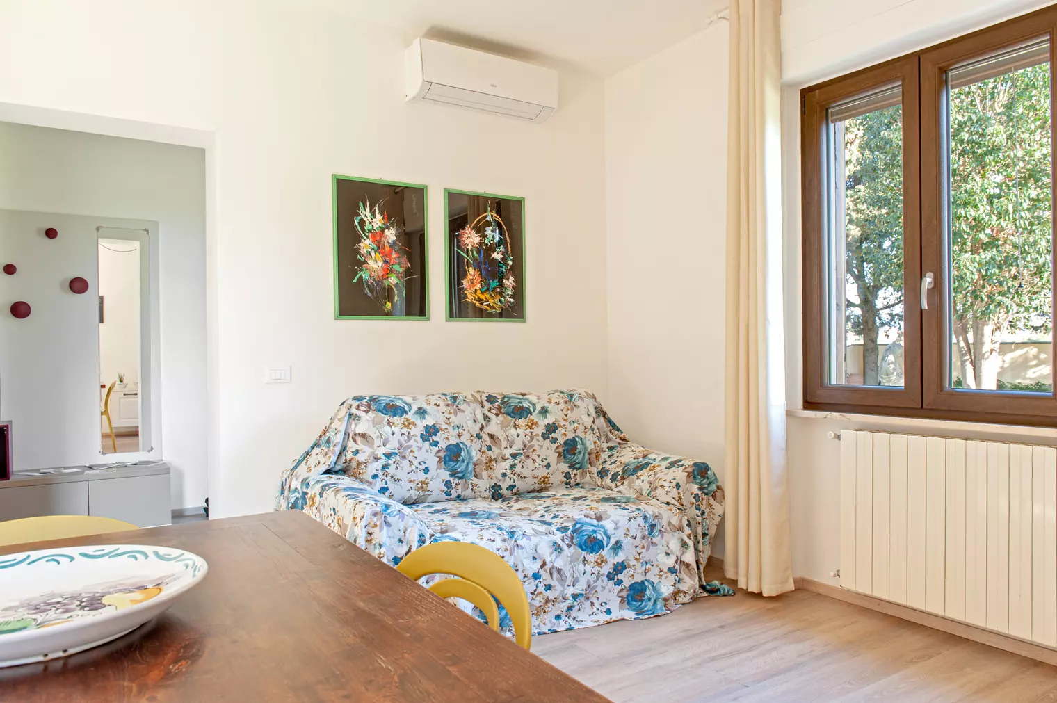 Comfortable sofa in the living area at Appartamento La Quercia