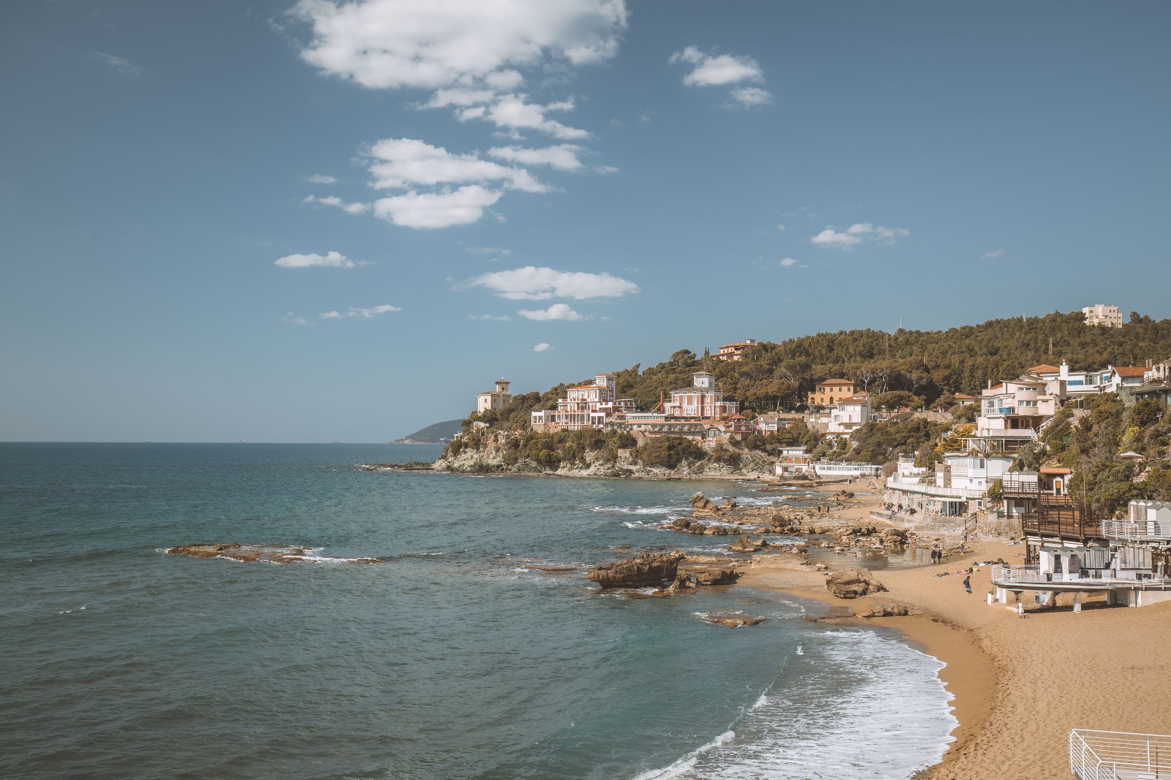 Rocky shoreline and seaside houses on the Tuscan coast