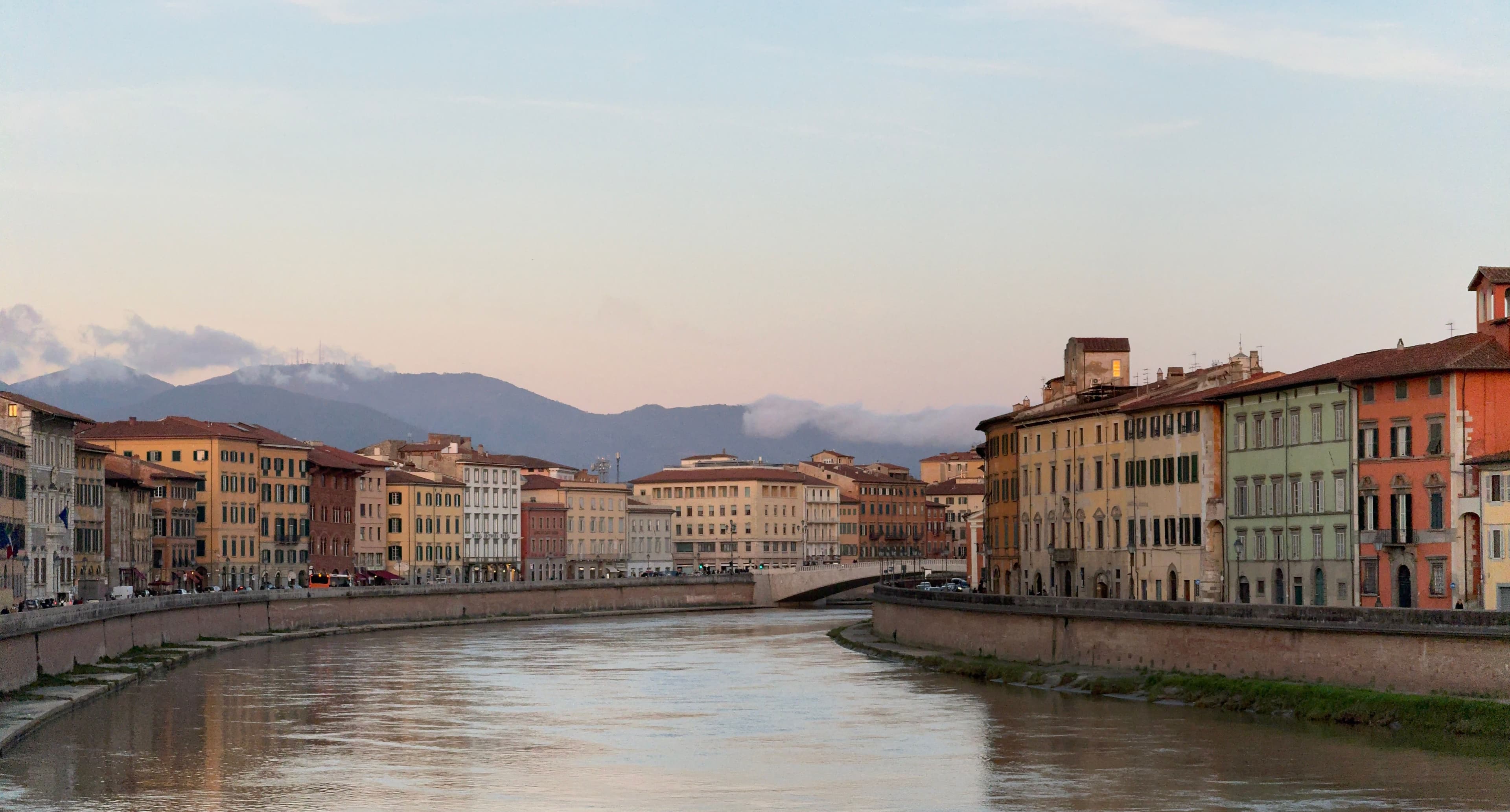 The Arno river and historic buildings in Pisa